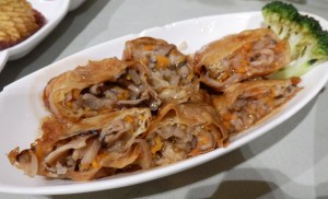 Mushroom and meat rolls wrapped in tofu skin. 