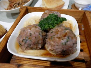 Beef balls with minced vegetables on top of tofu skin. 