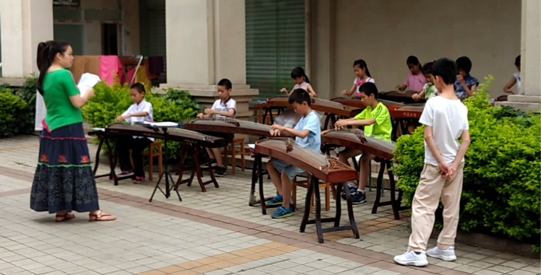 Finally! The kids perform on their “Guzheng.”